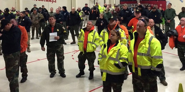 Law enforcement volunteers receive assignments Sunday Jan. 17, 2016, in search for missing 2-year-old. (TBI)