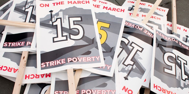 Dec. 5, 2013: Protest signs are pictured in SeaTac, Wash., before a march in support of raising the minimum wage to $15 an hour.
