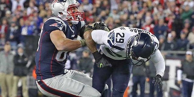 FOXBOROUGH, MA - NOVEMBER 13: New England Patriots Rob Gronkowski is hit by Seattle Seahawks Earl Thomas III forcing an incomplete pass during second quarter. The New England Patriots host the Seattle Seahawks at Gillette Stadium in Foxborough, Mass., on Nov. 13, 2016. (Photo by Matthew J. Lee/The Boston Globe via Getty Images)