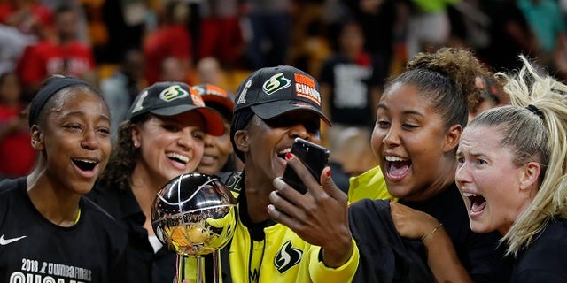 Members of the Seattle Storm are seen celebrating their WNBA championship.