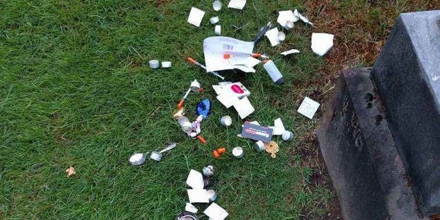 Groundskeepers frequently find trash and other debris at the cemetery in Seattle.