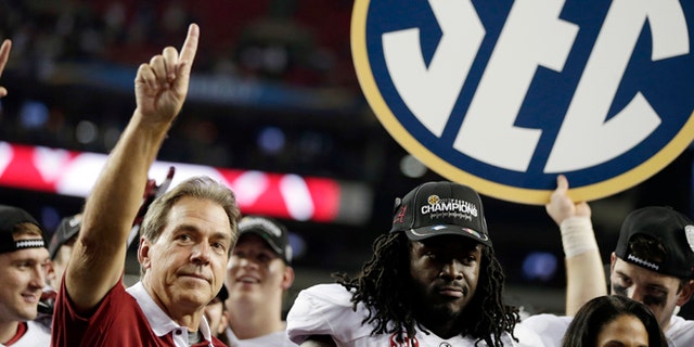 Dec. 1, 2012: Alabama head coach Nick Saban and running back Eddie Lacy after their 32-28 win in the Southeastern Conference championship NCAA college football game against Georgia in Atlanta.
