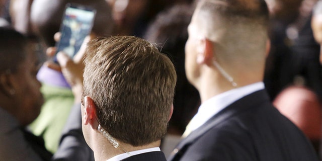Two unidentified U.S. Secret Service agents.