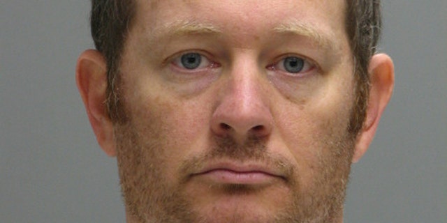 This booking photo provided by the Delaware Department of Justice shows Lee Robert Moore.