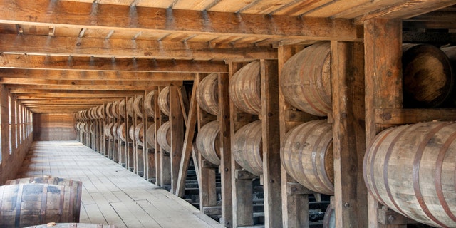 Whisky barrels on racks in the barrel house
