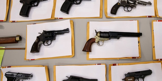 Guns seized on display at the Chicago Police Department Aug. 31, 2015.    