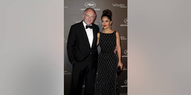 French billionaire François-Henri Pinault, who is married to Salma Hayek, pledged $113 million toward reconstruction efforts after a fire ravaged Paris' Notre Dame cathedral, causing substantial damge and the collapse of the structure's main spire.