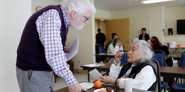 Patrick Arbore, left, talks to Corazon Leano as he conducts an anti-bullying class at the 30th Street Senior Center in San Francisco, April 13, 2018.