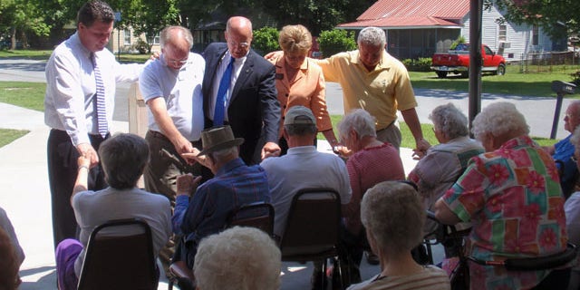 Port Wentworth Mayor Glenn "Pig" Jones, second from left, and Eric Johnson, a Republican candidate for governor, center, met with senior citizens Monday at the Ed Young Senior Citizens Center.