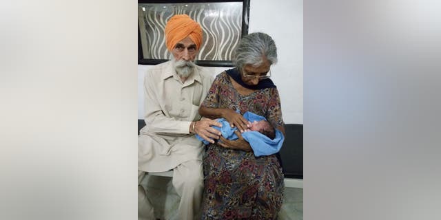 Mohinder Singh Gill and Daljinder Kaur with their newborn son.