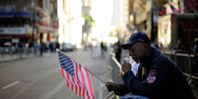 A man wipes away a tear as he listens to the reading of the names during New York City’s September 11th Commemoration Ceremony on Saturday, Sept. 11, 2010, on the ninth anniversary of the terrorist attacks.