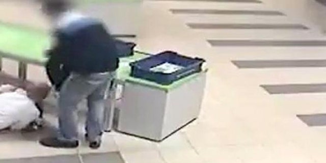 A quick thinking security guard at Katowice airport in Poland saved a toddler from injury by diving to catch him before the child fell off a table.