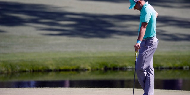 Sergio Garcia hangs his head on the 15th on his way to recording the third known 13 in Masters history.