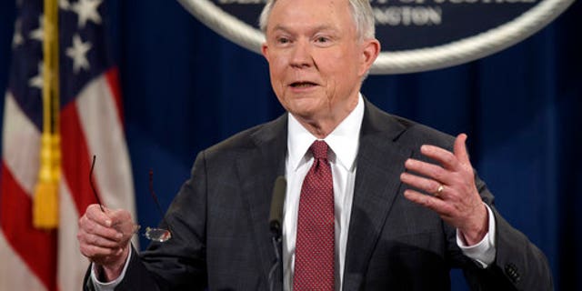 FILE - In this March 2, 2017, file photo, Attorney General Jeff Sessions speaks during a news conference at the Justice Department in Washington. City leaders across the U.S. are vowing to intensify their fight against President Donald Trump's promised crackdown on so-called "sanctuary cities" despite the financial risks. Defiance that filled a New York City gathering of municipal officials from urban centers clashed Monday, March 27, with pointed warnings from the White House's West Wing, where Sessions issued a dire warning to urban leaders. (AP Photo/Susan Walsh, File)