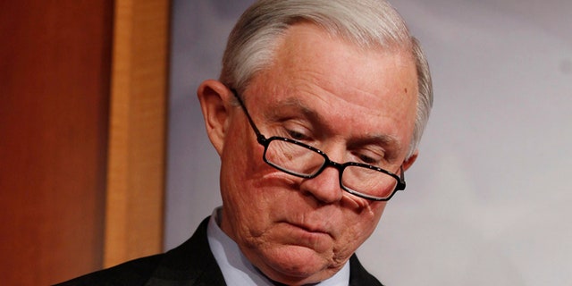 Feb. 3, 2012: Senate Budget Committee ranking minority member Sen. Jeff Sessions reads a copy of President Obama's budget.
