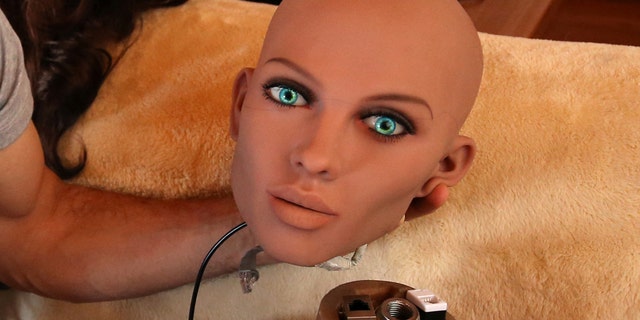 File photo: Catalan nanotechnology engineer Sergi Santos holds the head of Samantha, a sex doll packed with artificial intelligence providing her the capability to respond to different scenarios and verbal stimulus, in his house in Rubi, north of Barcelona, Spain, March 31, 2017. Picture taken March 31, 2017. (REUTERS/Albert Gea)