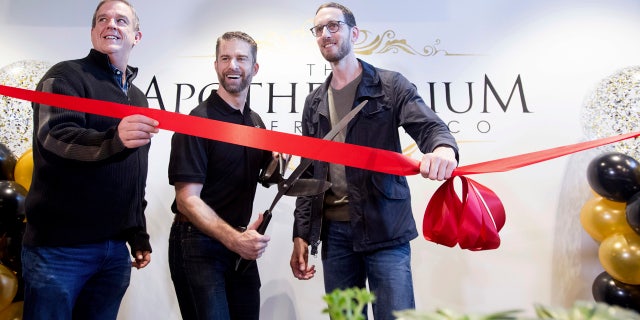California State Sen. Scott Weiner, right, celebrates the opening of The Apothecarium for recreational marijuana sales in San Francisco on Saturday, Jan. 6, 2018. Joining him are The Apothecarium co-founder and CEO Ryan Hudson, center, and San Francisco Supervisor Jeff Sheehy