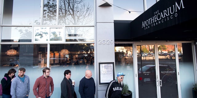 Customers wait for the opening of recreational marijuana sales at The Apothecarium on Saturday, Jan. 6, 2018, in San Francisco.