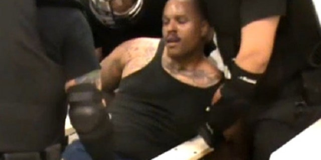 Brown was in distress in his final moments in an El Paso jail, before guards rushed in in riot gear. (Screengrab)