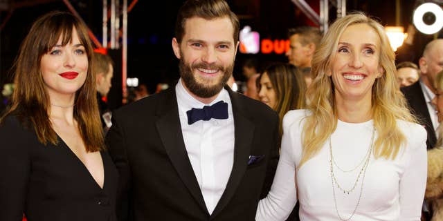 Feb. 11, 2015: Actress Dakota Johnson, actor Jamie Dornan and director Sam Taylor-Johnson, from left, pose for photographers on the red carpet for the world premiere of Fifty Shades of Grey at the 2015 Berlinale Film Festival in Berlin.