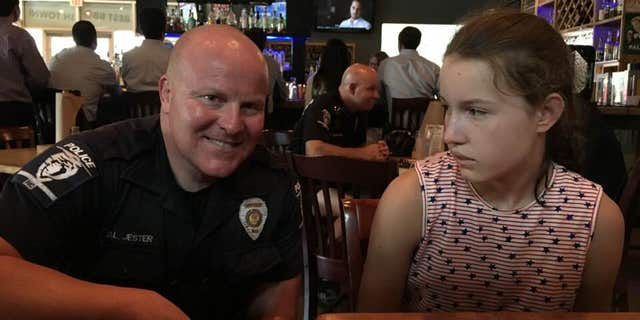 Cindy Frederick is grateful for a Charlotte-Mecklenburg Police officer who took time away from his meal to sit with her family and take a picture with her daughter in an effort to teach her that law enforcement can help her if ever needed.
