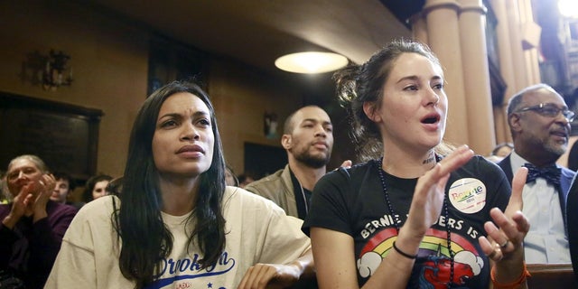 Actresses Rosario Dawson (L) and Shailene Woodley (R) listen to U.S. Democratic presidential candidate Bernie Sanders speak during a discussion at the First Unitarian Congregational Society in the Brooklyn borough of New York April 16, 2016. REUTERS/Lucas Jackson - RTX2A9XI