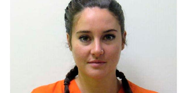 FILE - This October 2016 file photo provided by the Morton County Sheriff's Department in Mandan, N.D., shows actress Shailene Woodley who was arrested Monday, Oct. 10, 2016, during a protest against the Dakota Access pipeline. Woodley is to stand trial in North Dakota in early 2017 on charges related to her protest. (Morton County Sheriff's Department via AP)
