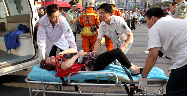 Sept. 27: Rescuers carry the injured after two subway trains collided in Shanghai, east China.