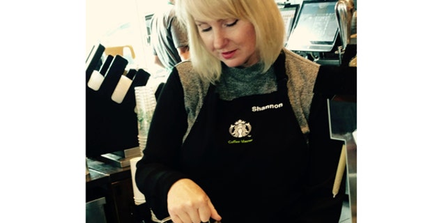 Shannon Feltz, a military spouse, serves coffee at the new Starbucks Military Family Store in Clarksville, Tenn.