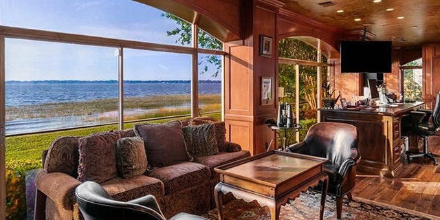The stunning property boasts sprawling waterfront views.
