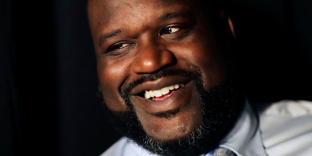 Former NBA basketball player Shaquille O'Neal sits off-set on a break from taping a commercial in Atlanta, Tuesday, April 18, 2017.