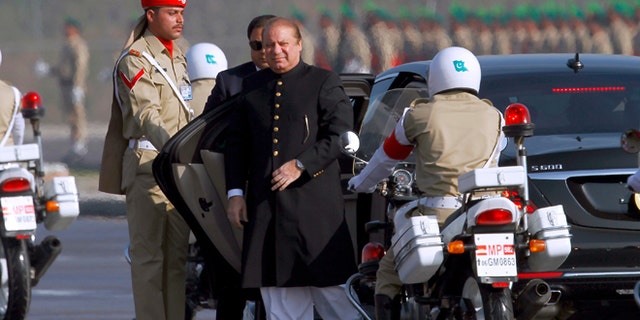 Pakistan's prime minister Nawaz Sharif, center, arrives to attend a military parade to mark Pakistan's Republic Day, in Islamabad, Pakistan, Thursday, March 23, 2017.