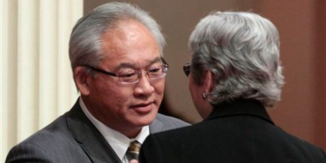 Assemblyman Paul Fong, D-Cupertino, thanks  Sen. Christine Kehoe, D-San Diego, for help after his measure banning the sale, trade or possession of shark fins was approved by the Senate in Sacramento, Calif., Tuesday, Sept. 6, 2011.