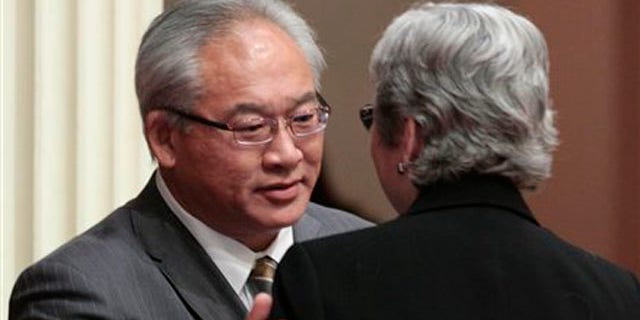 Assemblyman Paul Fong, D-Cupertino, thanks Sen. Christine Kehoe, D-San Diego, for help after his measure banning the sale, trade or possession of shark fins was approved by the Senate in Sacramento, Calif., Tuesday, Sept. 6, 2011.