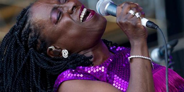 This June 8, 2012 file photo shows soul singer Sharon Jones of Sharon Jones and The Dap-Kings performing during the Bonnaroo Music and Arts Festival in Manchester, Tenn.