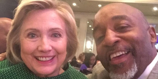 Kenneth Glasgow, right, is seen with former Democratic presidential candidate Hillary Clinton.