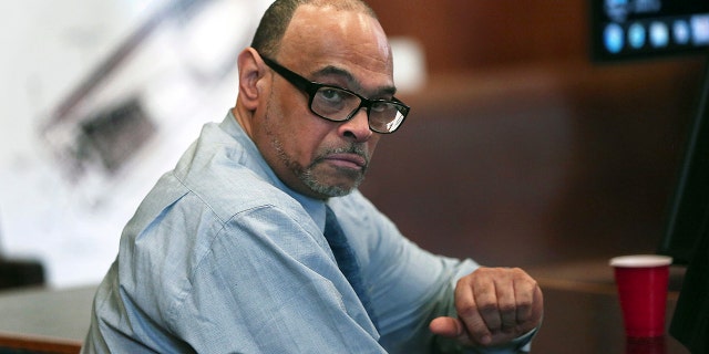 In this May 30, 2018, photo, Shaun Harrison reacts as attorneys give closing arguments in Suffolk Superior Court in the jury trial of him in Boston.