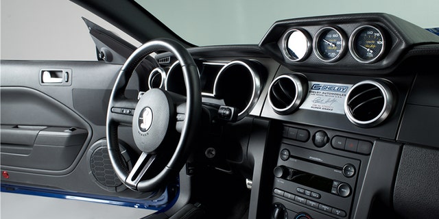 The Shelby has the VIN 007 and less than 900 miles on the odometer.
