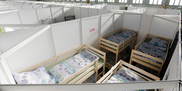 Dec. 9, 2015: Cabins are set up inside Hanger 4 of the former airport Tempelhof to be used as a temporary emergency shelter for migrants, refugees and asylum seekers in Berlin