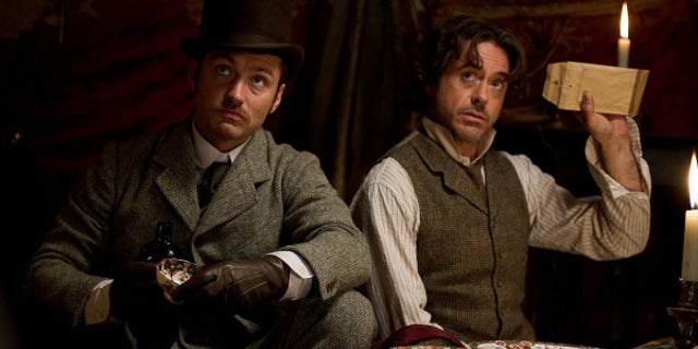 Robert Downey, Jr., right, and Jude Law star as Sherlock Holmes and Dr. Watson in “Sherlock Holmes: A Game of Shadows.” (Warner Bros. 2011)
