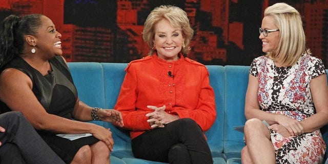 This June 25, 2014 photo released by ABC shows, from left, Sherri Shepherd, Barbara Walters and Jenny McCarthy on the daytime talk show "The View," in New York.