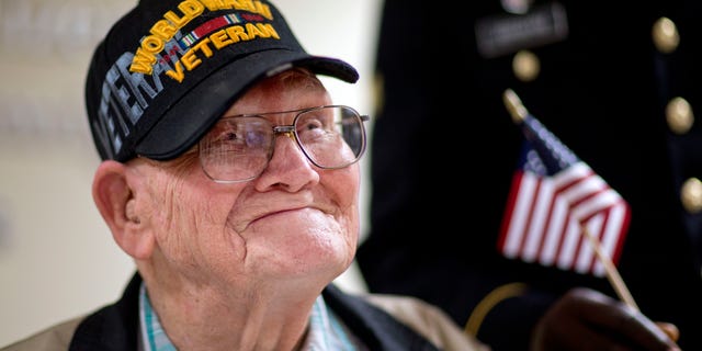 June 2, 2014: Ninety-four-year-old World War II veteran Sherwin Callander talks to the media after a naturalization ceremony.