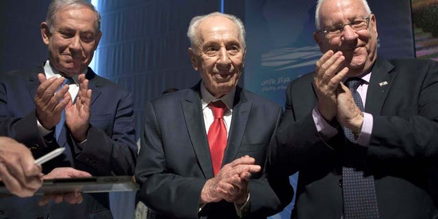 July 21, 2016: Israeli Prime Minister Benjamin Netanyahu, left, former Israeli President Shimon Peres, center, and Israel's President Reuven Rivlin are seen during a ceremony at the Peres Center for Peace in Jaffa, Israel.