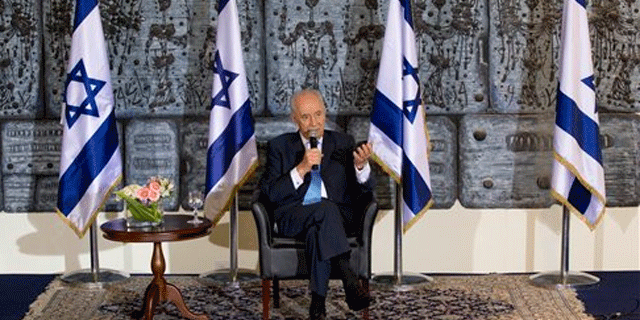 July 26: Israel's President Shimon Peres attends a press conference for Arab media in his residence in Jerusalem. Peres made an attempt at outreach to the Arab world with his first official press conference to Arab media on Tuesday, including outlets from countries that do not have diplomatic relations with Israel.