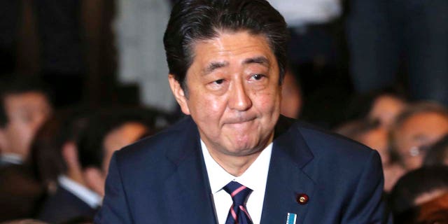 Liberal Democratic Party President Shinzo Abe receives applause from the LDP lawmakers shortly after his name was called as the winner of the ruling party presidential elections at its headquarters in Tokyo, Sept. 20, 2018.