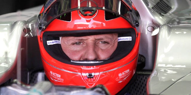 FILE - In this Nov. 23, 2012 file photo, Grand Prix driver Michael Schumacher, of Germany, sits in his car during a free practice at the Interlagos race track in Sao Paulo, Brazil. (AP Photo/Victor Caivano, File)