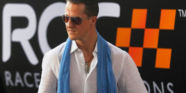 Driver Michael Schumacher from Team Germany arrives at the Rajamangala National Stadium before a practice for the Race of Champions (ROC) in Bangkok December 16, 2012. The Race of Champions runs from December 14 to 16. REUTERS/Chaiwat Subprasom (THAILAND - Tags: SPORT MOTORSPORT) - RTR3BML4