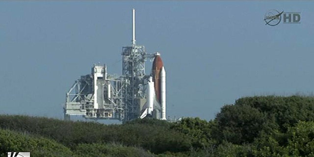 Space shuttle Endeavour sits on the launchpad awaiting blast-off on its final mission, STS-134.