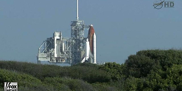 Space shuttle Endeavour sits on the launchpad awaiting blast-off on its final mission, STS-134.