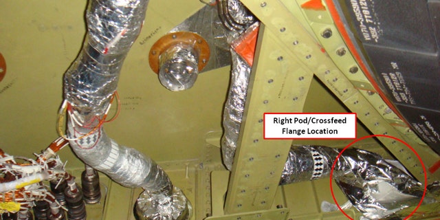 This photo released by NASA shows the connecting point in a fuel line, labeled and circled by NASA, which had been leaking on space shuttle Discovery's right-side orbiter maneuvering system engine.